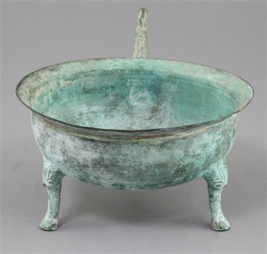 A Chinese archaic bronze tripod wine-warming vessel, Jiao Dou, Eastern Han dynasty, 1st-3rd century A.D., 13.5cm high, 32cm long